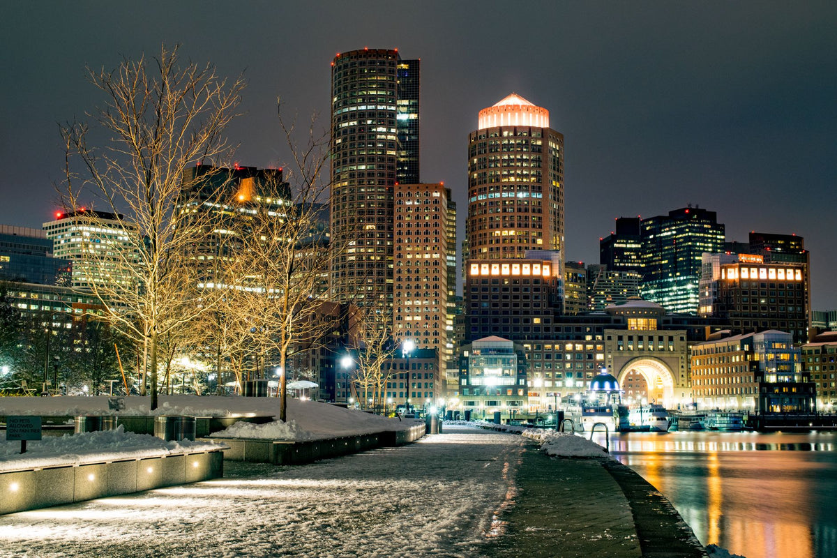 Downtown Boston at night with a snowy waterfront